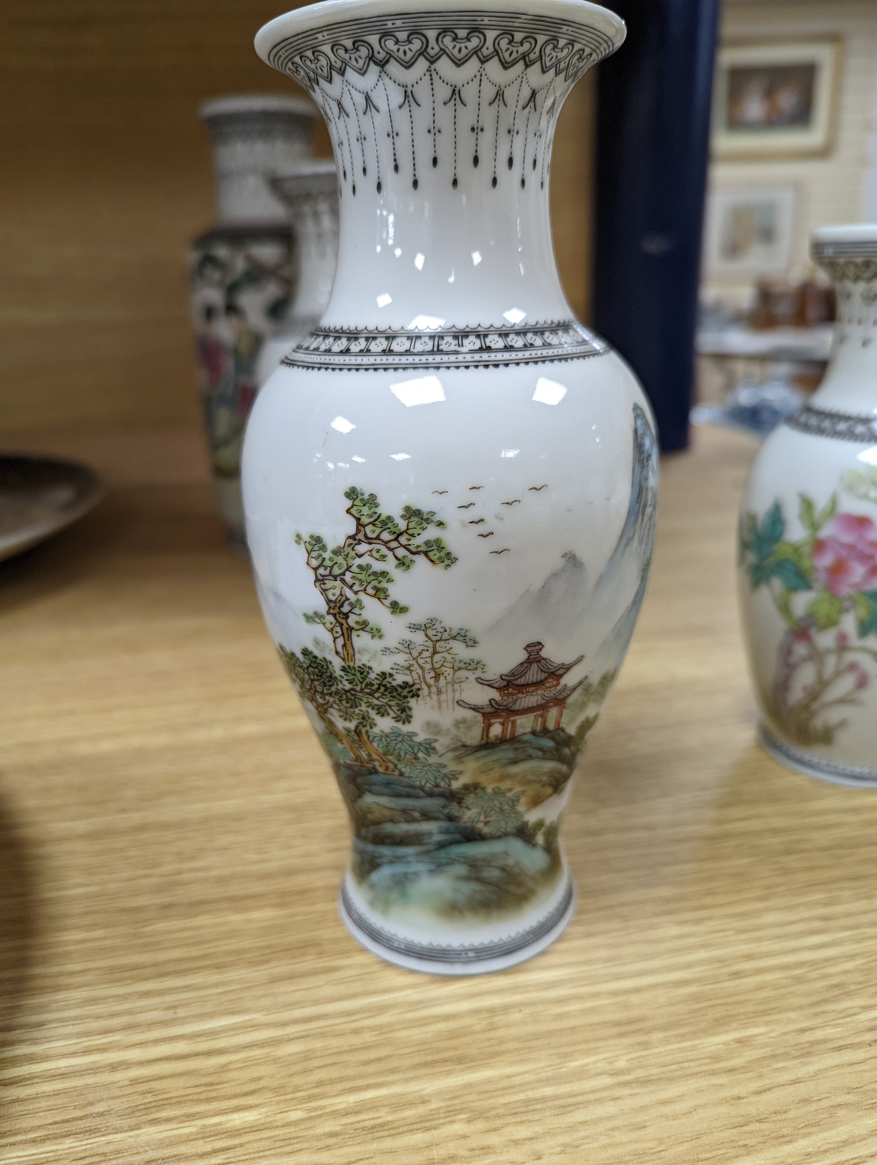 A group of seven Chinese famille rose vases, 20th century